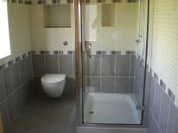 Double shower tray and glass enclosure with wall hung wc and consealed cistern with push flush Double shower tray and glass enclosure with wall hung wc and consealed cistern with push flush