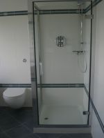Shower tray and enclosure with wall hung wc pan and concealed cistern push flush Shower tray and enclosure with wall hung wc pan and concealed cistern push flush