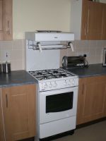 Gas cooker with eye-level grill Gas cooker with eye-level grill